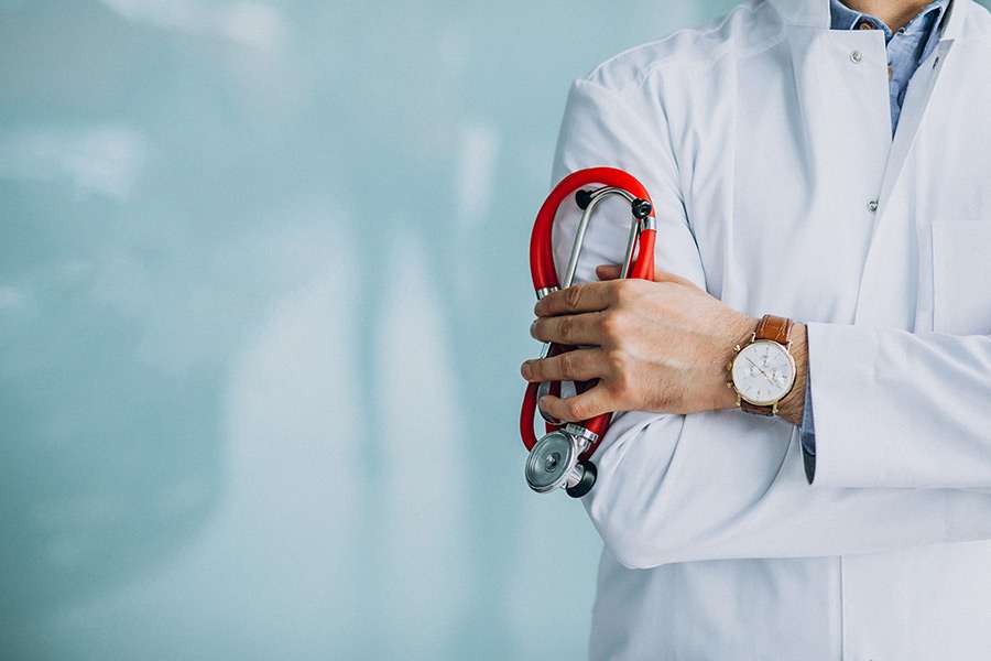 Healthcare professional holding a stethoscope, symbolizing patient care and medical diagnostics