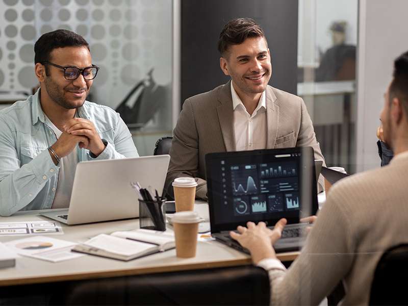 Business professionals in a boardroom meeting discussing SAP solutions and enterprise software strategy